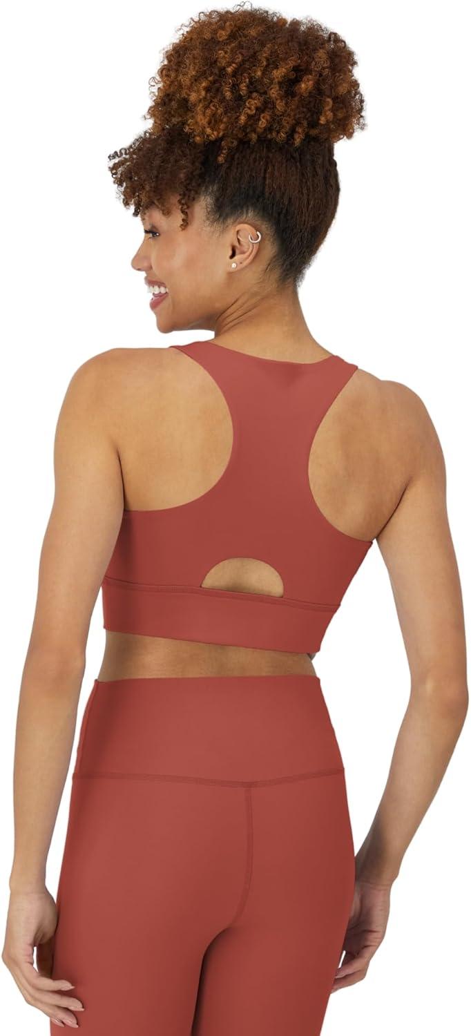 imageHanes Womens Sports Bra Moves Racerback Crop Top Yoga Bras for Women Stretch Sports Crop Top with Cutout WickingCoral Camelia